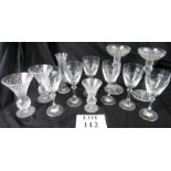 Six etched wine glasses and a variety of