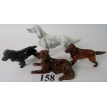 Four porcelain models of dogs, comprisin