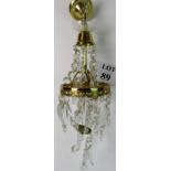 A vintage electric light fitting with br