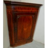 A Georgian inlaid mahogany corner cupboa