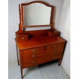 An Edwardian mahogany dressing table wit