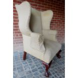 A 19th century framed wingback armchair