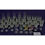 A quantity of cut glass stemmed glasses,