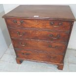 A Georgian mahogany commode chest with lift up top and dummy drawers to front,