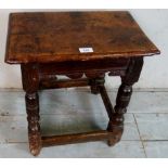 A fine 17th century oak joint stool with a carved frieze over turned legs and stretchers,