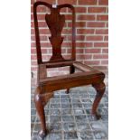 A Georgian country elm occasional chair with carved back splat,