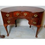 A c1920 mahogany kidney desk with 5 drawers, brass handles and cabriole legs,