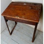 An early 20th century small oak and metal school desk,