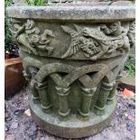 A decorative garden planter with moulded design,