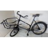 An early-mid 20th century butcher's delivery bike with basket to front and in good codition,