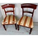 A pair of Victorian mahogany chairs with cream and bronze upholstery,