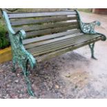 A vintage slatted garden bench with decorative cast iron end supports est: £50-£80