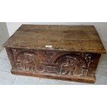 A late 17th/early 18th century carved oak bible box, with Dutch figural panels to front,
