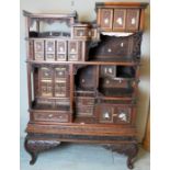 A fine quality Meiji period Japanese display cabinet, with shibayama filigree and carved panels,