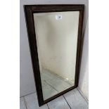 A 20th century oak framed bevelled edge wall mirror,