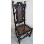 An antique Carolean style high back chair, with cane work seat and back panel, a/f,