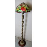 Ornate gilt metal standard lamp with faux Tiffany style shade,
