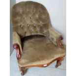 Victorian carved mahogany show-wood framed armchair with buttoned green upholstery,