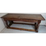 A superb 17th century oak refectory dining table, with a three planked solid oak top,