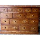 A 20th century pine bank of 13 assorted drawers, with turned handles, good solid construction,