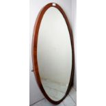 A large late 19th century oval mahogany mirror,