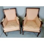 A pair of Regency style library chairs upholstered in a pink stripe material,