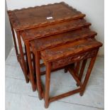 A set of 4 carved nesting tables, one with fitted drawer,