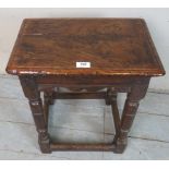 A late 17th century oak joint stool with a detailed frieze over turned legs and stretcher,