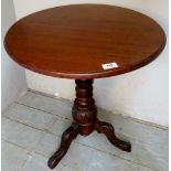 A Victorian mahogany round tripod lamp table with a carved column base,