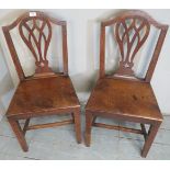 A pair of 19th century oak hall chairs with solid oak seats,