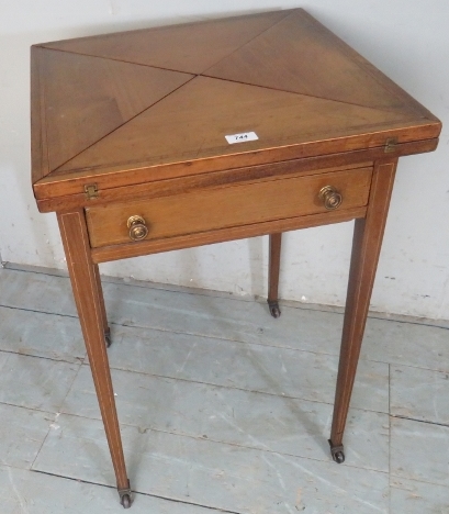 An Edwardian pale mahogany inlaid envelope card table with a green baize over a single drawer,