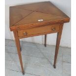 An Edwardian pale mahogany inlaid envelope card table with a green baize over a single drawer,