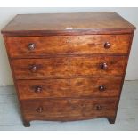 A George III oak chest of two short over three long drawers, with turned handles and bracket feet,