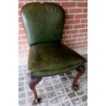 A mahogany framed Chippendale-Revival desk chair upholstered in brass studded deep green leather