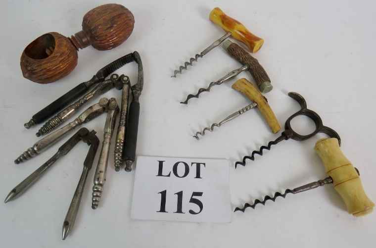 Two antique corkscrews and three others,