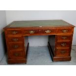 A c1900 oak pedestal writing desk with a