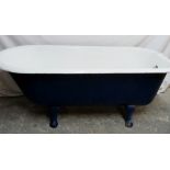 A cast iron bath tub with painted exteri