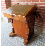 A Victorian walnut Davenport desk with a