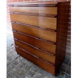 A mid century teak chest of 6 long drawe