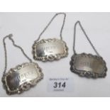 Three silver decanter labels with shell