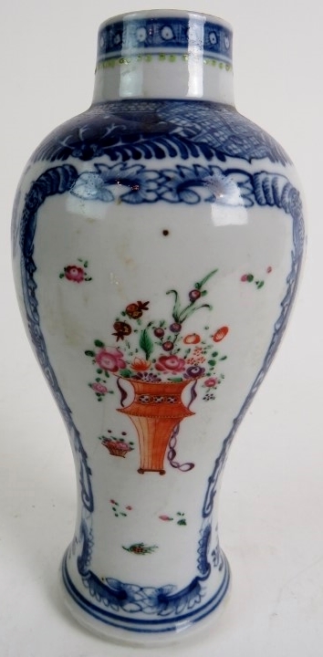 A 19th century Chinese export vase with blue and white border and a central polychrome floral spray,