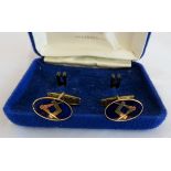 A pair of 9ct golf and blue enamel masonic cufflinks (boxed).