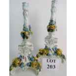 A pair of 19th century German porcelain candle holders,