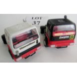 Two Hornby racing trucks, one in Texaco livery, the other Ever Ready.