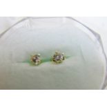 A pair of diamond stud earrings, marked 925, boxed.