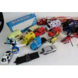 A selection of toy cars including boxed 'En Voiture Tintin', 'New Holland',