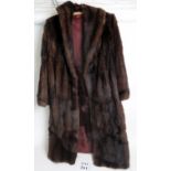 A ladies full length mink fur coat, approx size 14, with bag, from the 1940's or 50s',