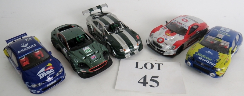 Five slot racing cars (a couple a/f), an Aston Martin DBRG, a Jaguar XKRS,