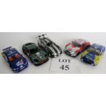 Five slot racing cars (a couple a/f), an Aston Martin DBRG, a Jaguar XKRS,