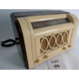 An HMV Radio model #1356, from 1948 in cream bakelite and dark wood.